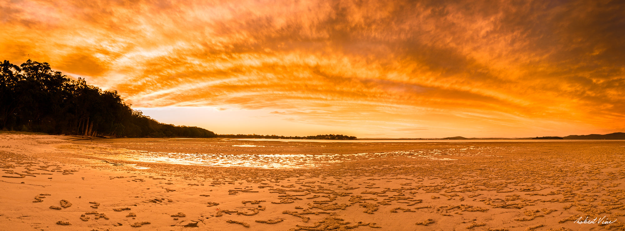 Limited edition framed panoramic photograph of Tanilba Bay, Port Stephens at sunset by Australian landscape photographer Robert Vine, with golden sky and tidal flats.