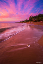 Fine art landscape photograph of Nightcliff Beach at sunset — pink and purple clouds reflect over calm waves and sandy shore, Australian coastal landscape art print by Robert Vine.