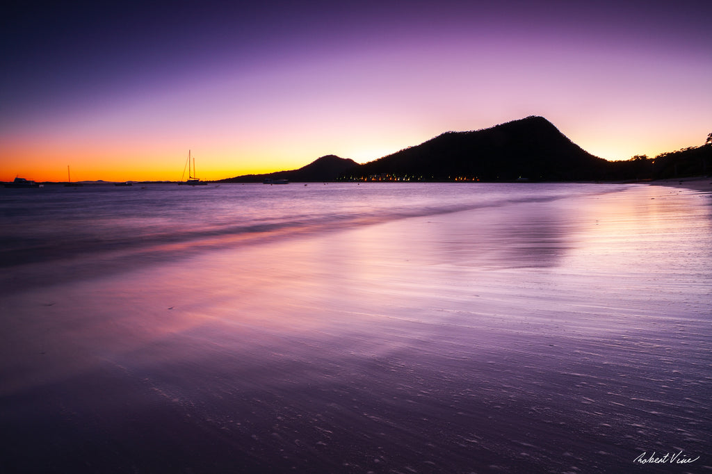 Limited edition framed print of Shoal Bay at dusk, Port Stephens by Robert Vine, with soft waves, glowing sky and silhouetted headlands