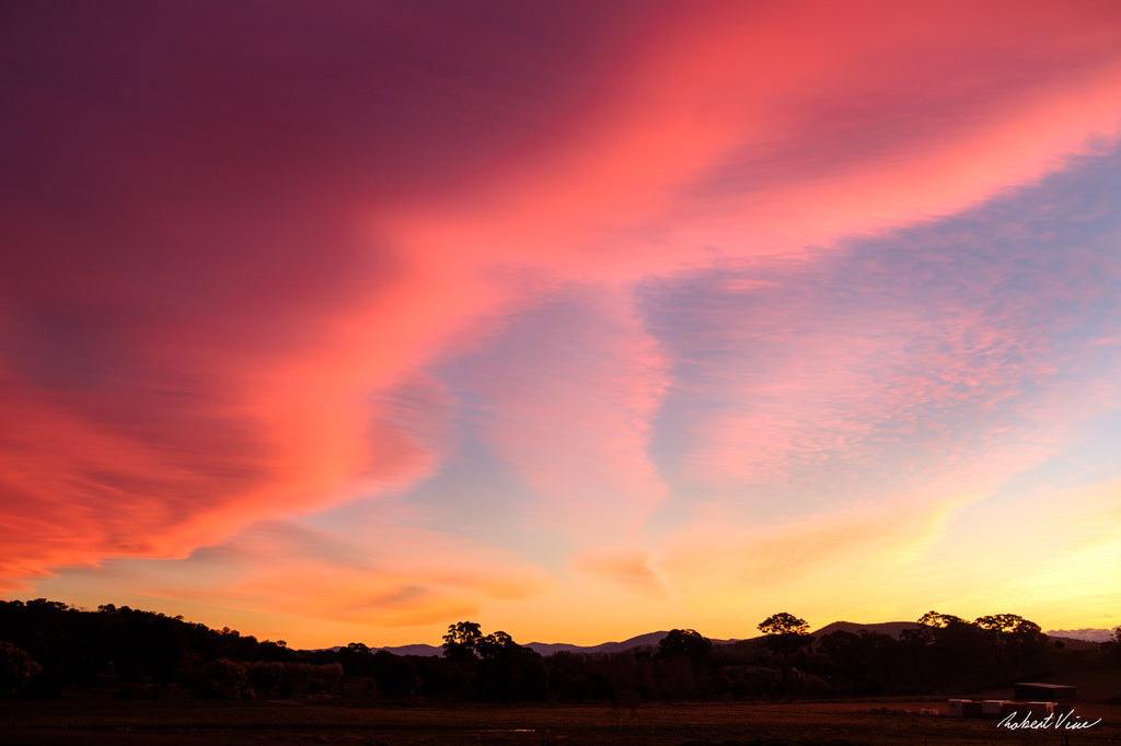 Limited edition framed art print of a dramatic pink and orange sunset sky over Royalla near Canberra, photographed by Robert Vine.