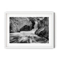 Framed black and white photograph of flowing water cascading through sculpted granite rocks at the Googong Cascades, captured by Robert Vine.