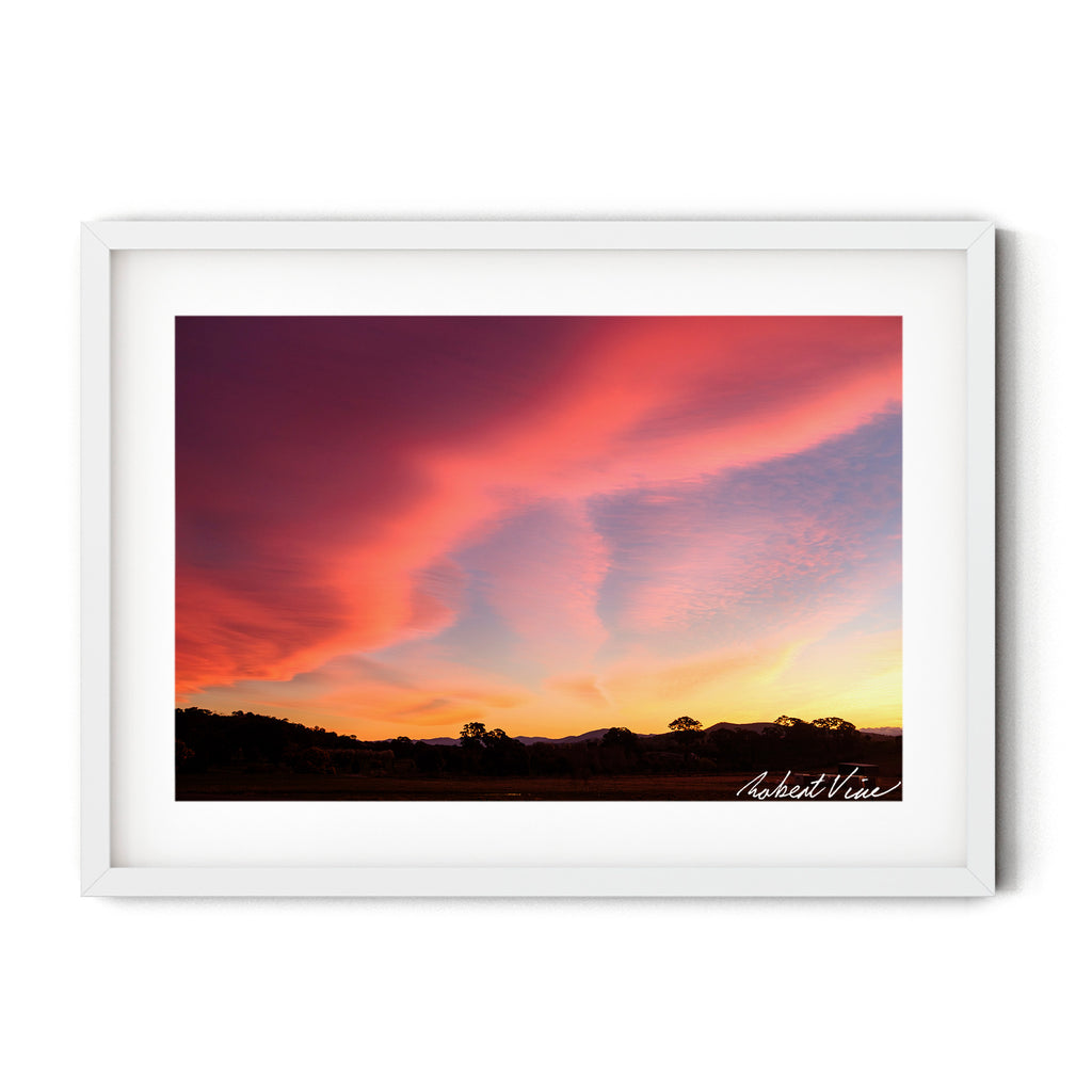 Limited edition framed art print of a dramatic pink and orange sunset sky over Royalla near Canberra, photographed by Robert Vine.